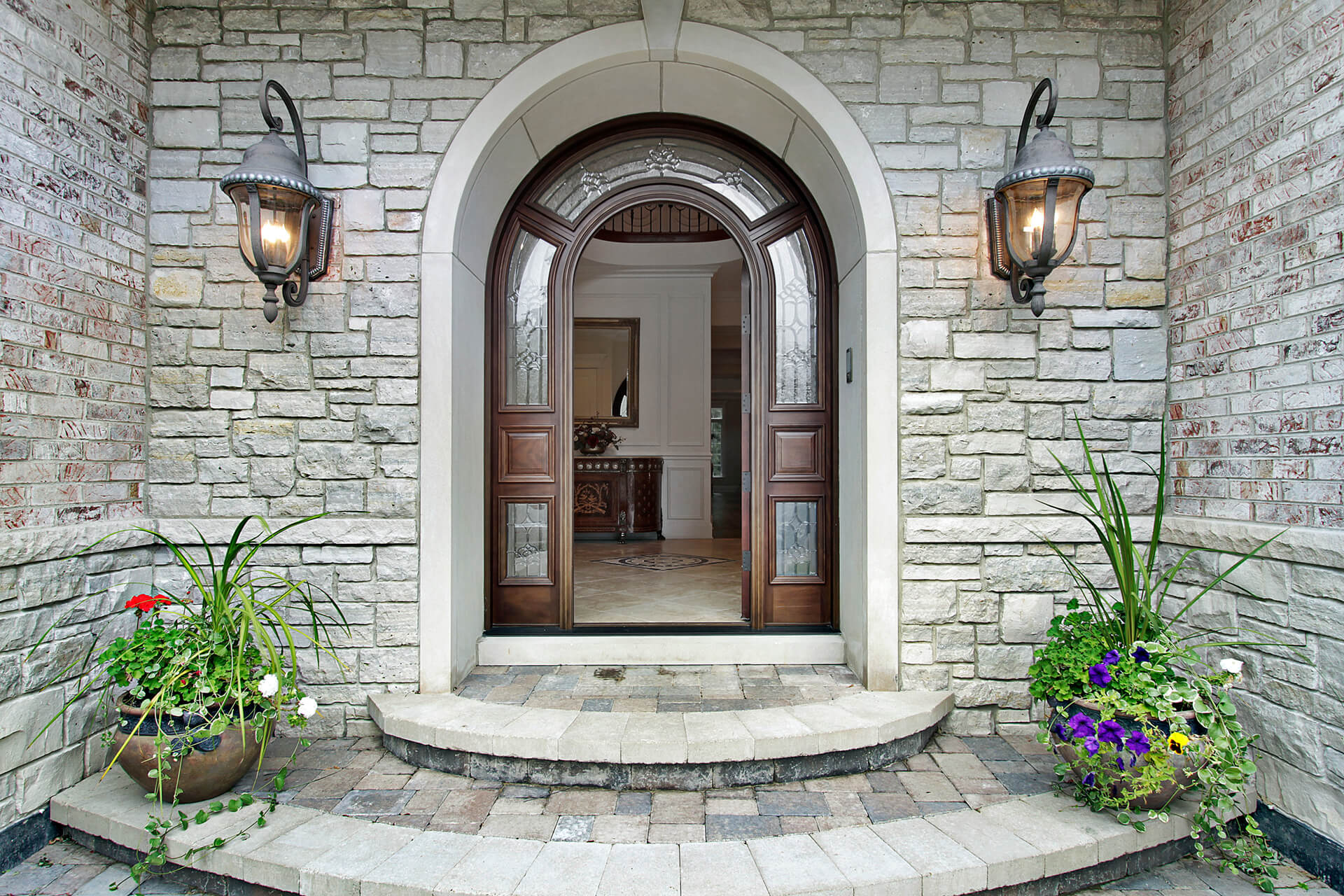 Arched wooden door of a luxury home.