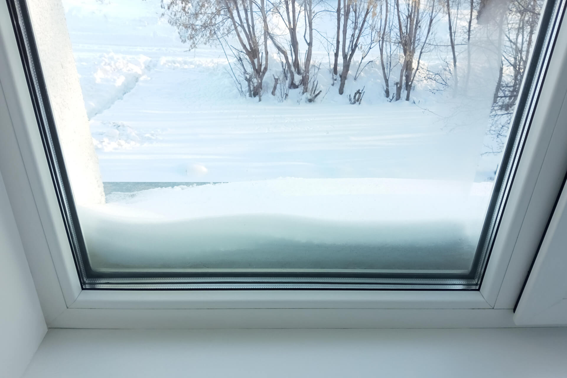 Snow buildup by window.